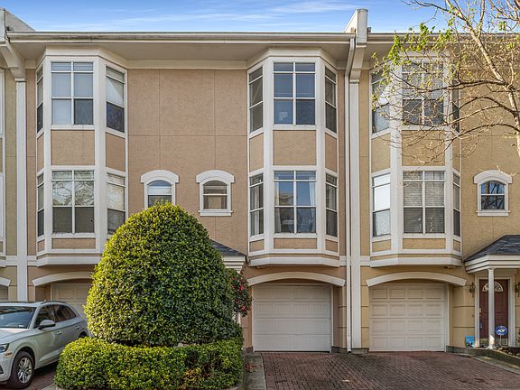 Front of townhome view with garage