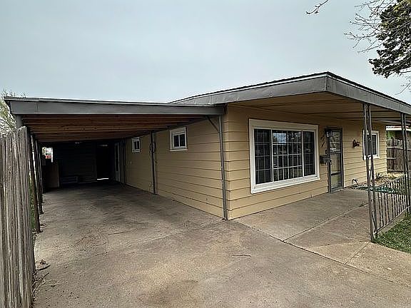 Carport with side entrance 