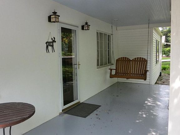 An inviting and quiet front porch welcomes you home.