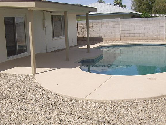 easy care backyard with Pebble tech pool