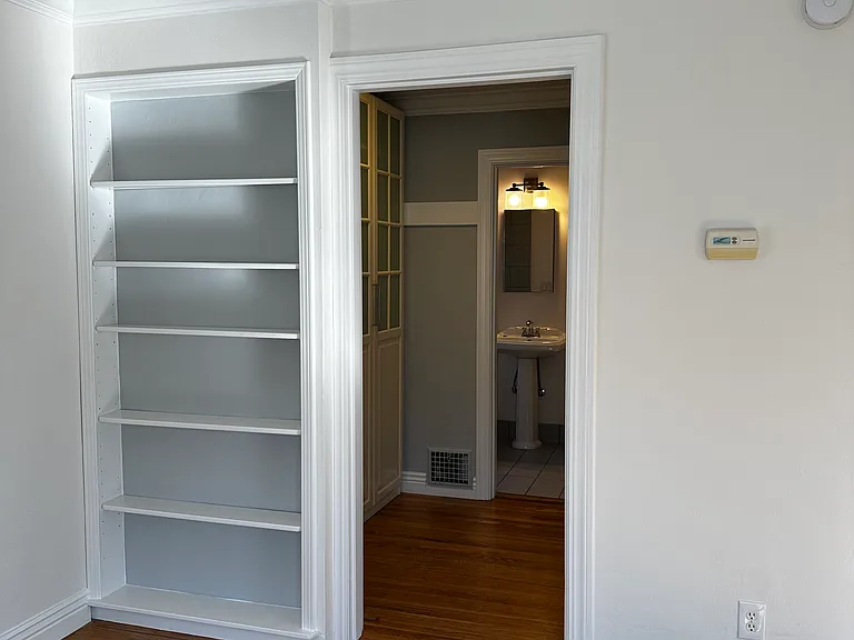 Main room looking through closet to bathroom.