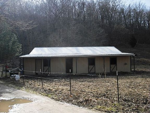 5 horse stall attached to barn