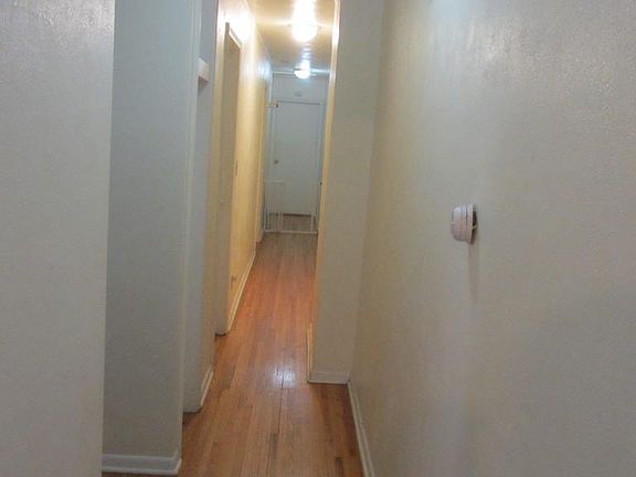 Hall leading to 3 upstairs bedrooms and 2 bathrooms
