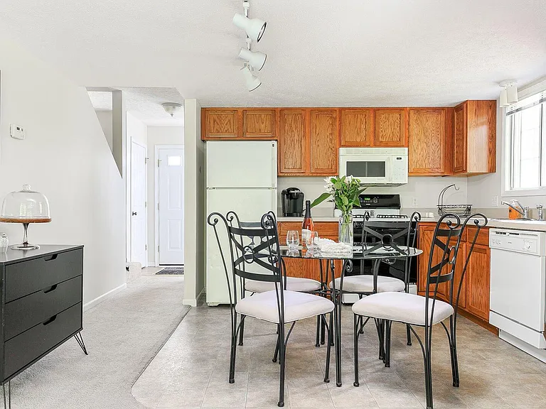 Kitchen and Dinette. Refrigerator with Icemaker, Microwave Oven, Gas Range and Oven, and Dishwasher