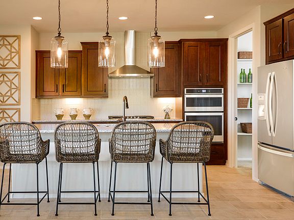 The Kitchen is Complete with an Oversized Pantry and Plenty of Overhead Lighting