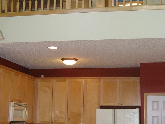 Kitchen showing loft above