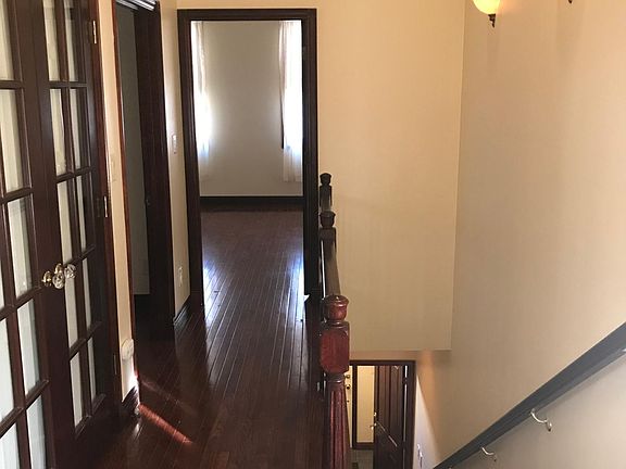 View of Upstairs Entry with Plaster Coving on the ceiling and Closet to the Left, 2nd BR Door down the Hall and Master BR at the end of Hall