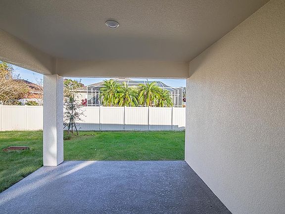 Your living space extends outdoors to a covered lanai - Ashlyn by Highland Homes