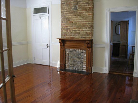 Partial view of bedroom. Door on upper right leads to kitchen and bathroom beyond that