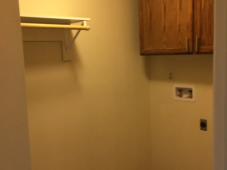 Laundry room. Washer and dryer included. Not shown