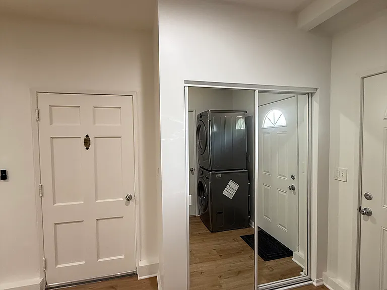 Full length mirror closet and patio access door.