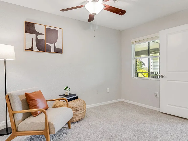 Spacious bedroom with multi-speed ceiling fan.