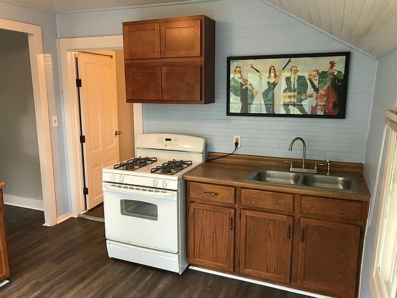 Kitchen. Note the brand new double cabinets above stove.