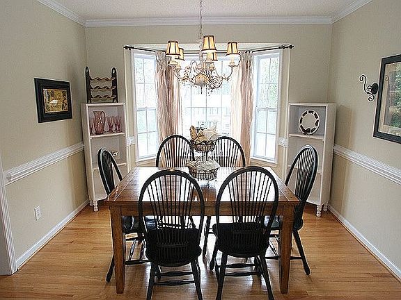 Wood floors are in the entry way and dining room.