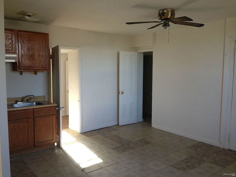 Living Room looking to Den and Bath Entry