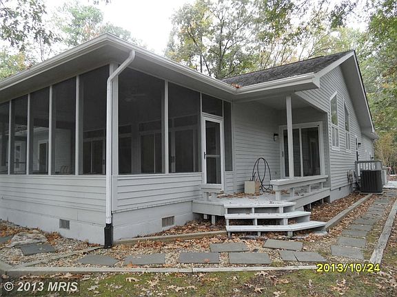 Side showing screened porch & entrance to kitchen