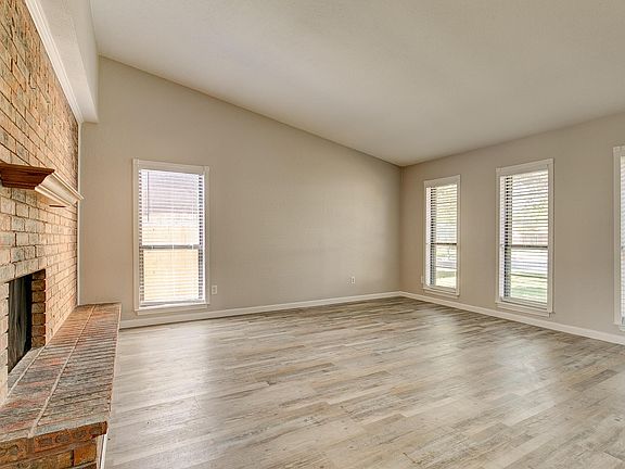 The spacious family room features large windows which allow for plenty of natural light.