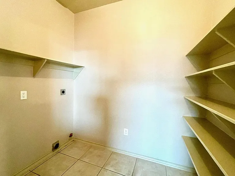 Washer and dryer hookup's with pantry area.