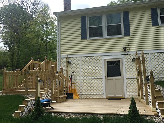 Entrance with deck facing yard