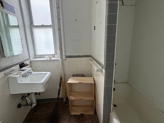 The unit is currently undergoing renovations, and updated photos will be available soon.
