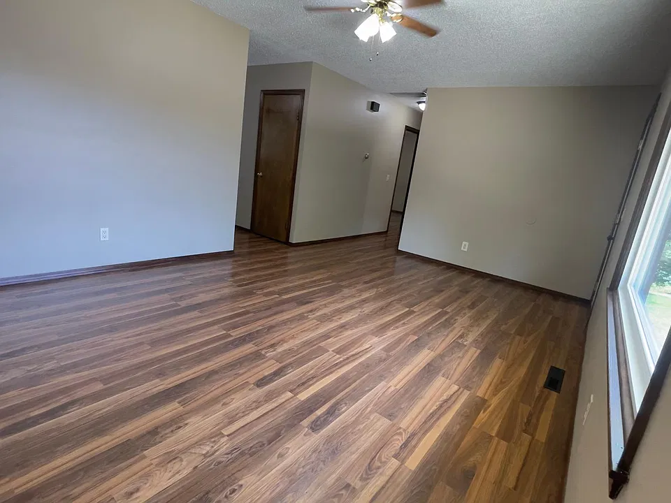 Living Room with View to hallway leading to Bedrooms and Kitchen