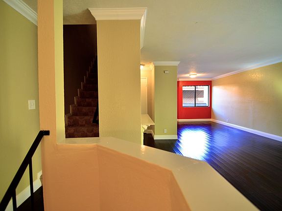 Living room with entry from the garage downstairs and upstairs 2 bedrooms.