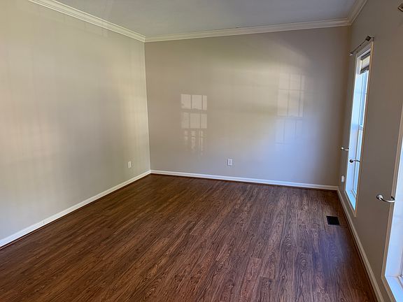 The living room is located on the front of the home off of the entry area. This could be a great living area or could be used as an office
