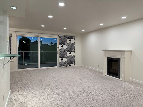 Living room with new carpet and recessed lights