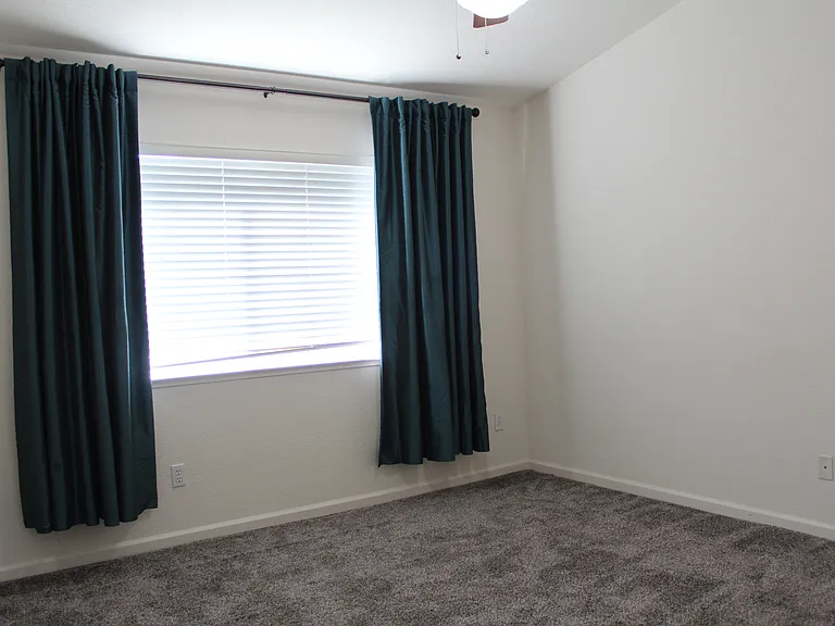 primary bedroom with vaulted ceiling