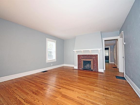 Hard wood floors throughout most of the main level, carpet in the back family room. Fireplace is non-functional.