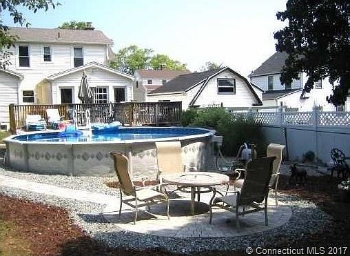 Backyard with back deck and above ground pool