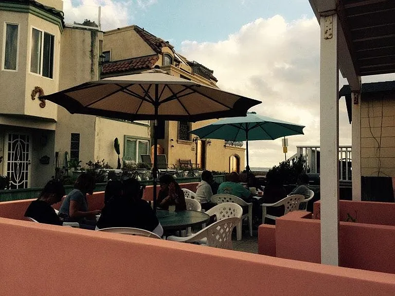 Patio with lots of seating and multiple BBQs