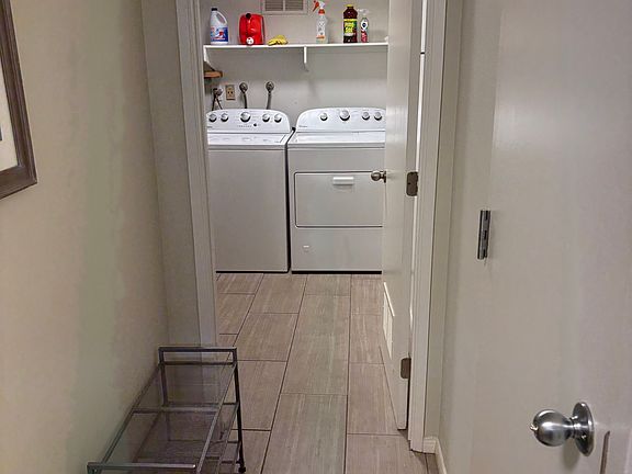View to laundry room, garage to right