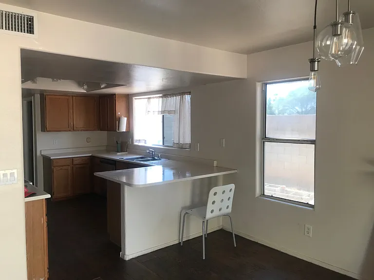 kitchen with big windows and lot of counter space. Kitchen being updated with new granite countertops should be ready by mid August. Nice granite bar/dining extension is being installed and will be ready by mid August.
