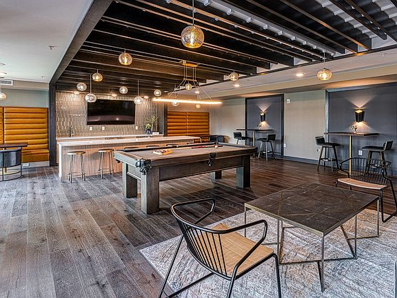 Host a few friends for a round of pool or crack open a good book in the club room