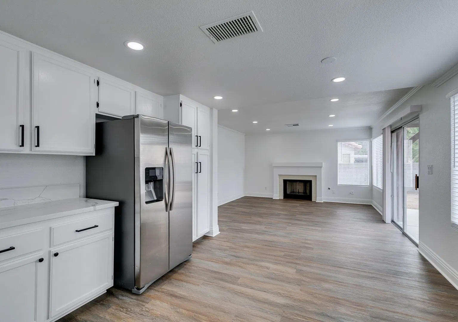Updated 4-Bedroom Home with Spacious Backyard! — Photo 3