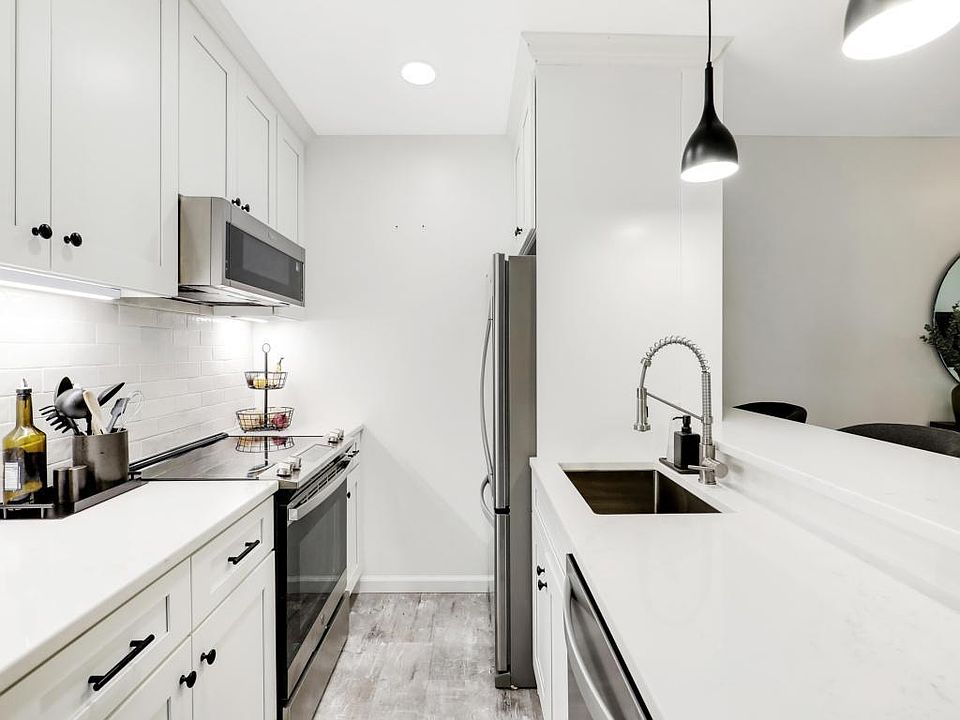 Kitchen features stainless steel appliances (including dishwasher), large sink w/ garbage disposal, new cabinets, quartz countertop, tile backsplash, under-cabinet lighting, and all lights are dimmable. There is also a pantry area next to the kitchen for