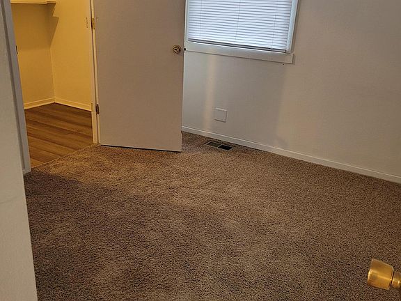 First bedroom upstairs showing large closet where laundry hook-ups are.