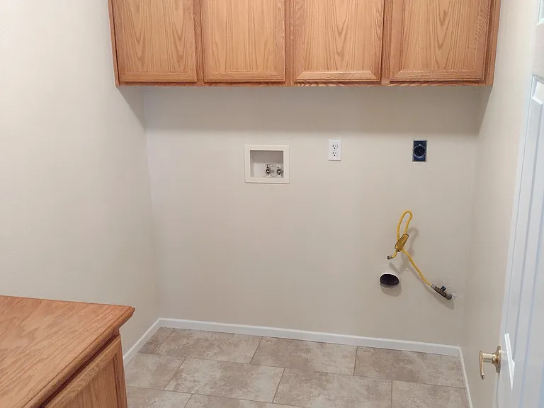 The laundry room has enough space for all your needs