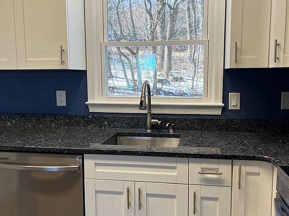 Kitchen sink with view of forest