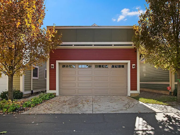 Two car garage with one dedicated parking space on the drive. Additional parking available in city lot just steps away.