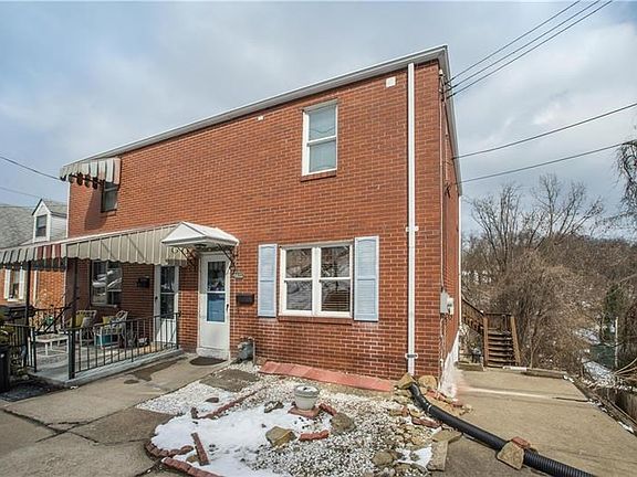 This brick half a duplex is located minutes from the city!