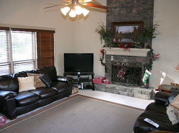 Family room w/stacked stone fireplaces