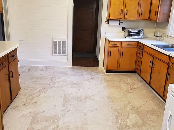 Kitchen facing hallway to Bedrooms and main bathroom. To the left is the dining room.