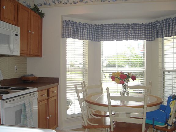 Great kitchen with bay window with views of pond and fountain