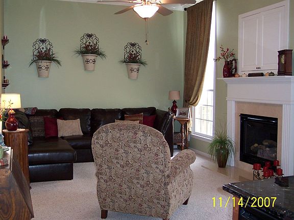 family room with media cabinet above fireplace