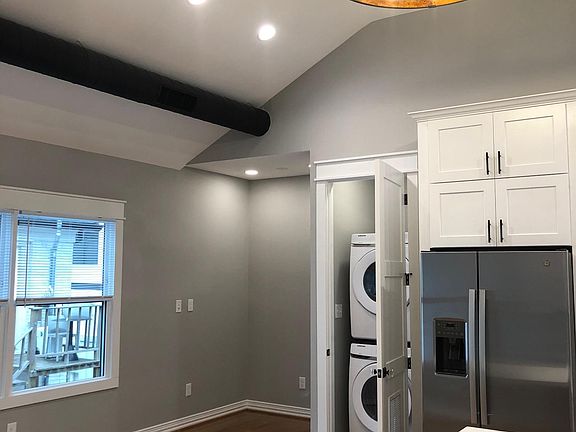 beautiful high ceilings, office or breakfast nook off of the living room, open floor concept with island seating in the kitchen as well