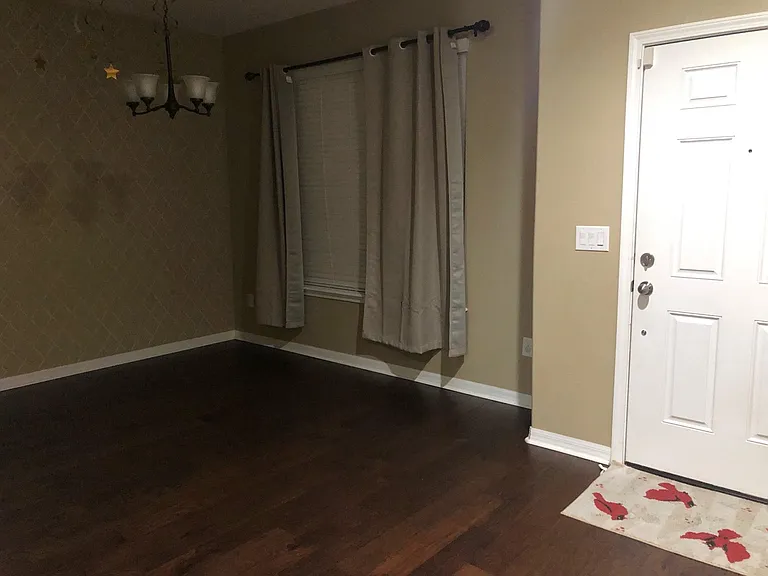 Entry door and Formal dining space / Flex room for work-from-home office.