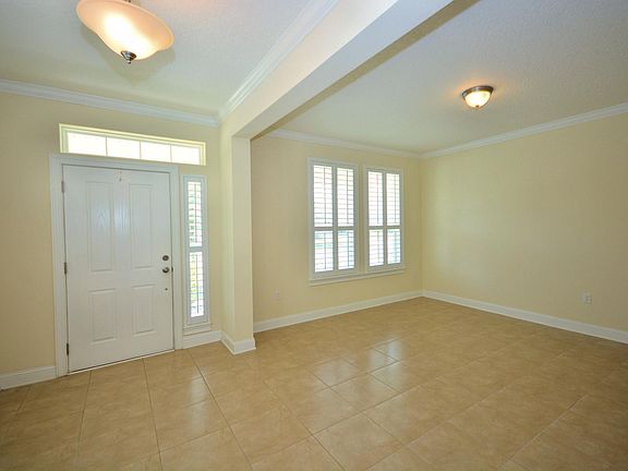 Home entrance with flex space for formal dining or living room