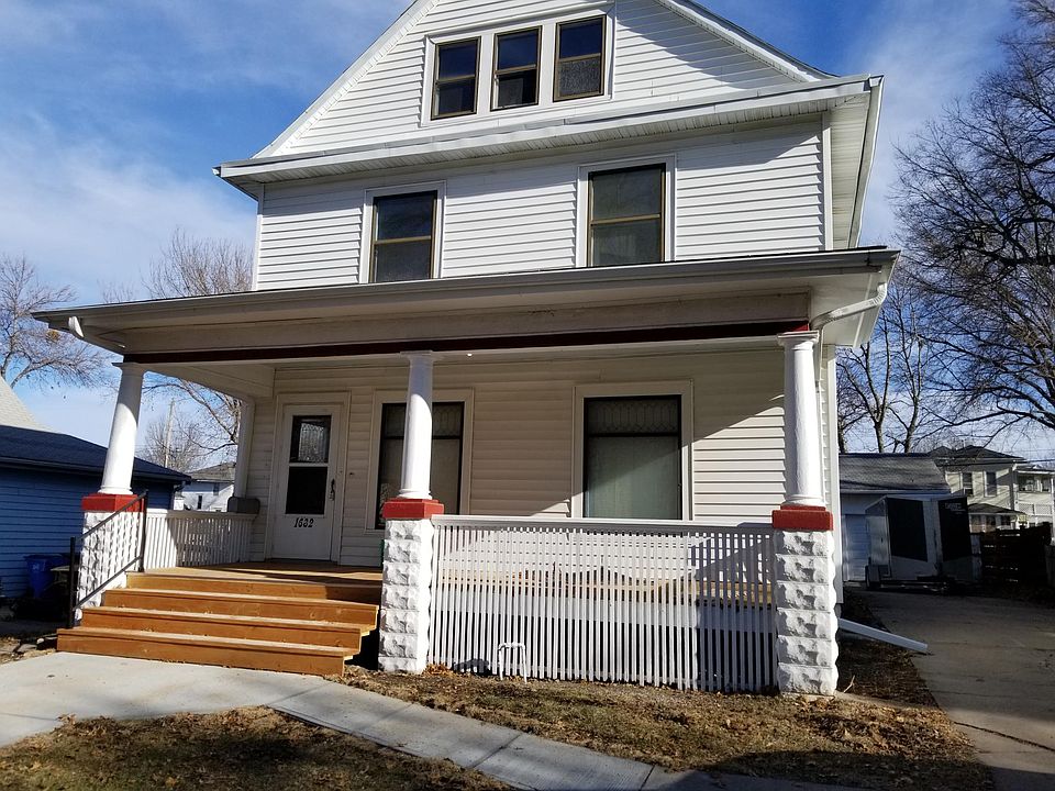 Main house with large front porch. 2 apartment units. #1 on first floor. #2 on second and 3rd floor